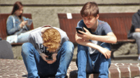 Boys Looking at mobile phones