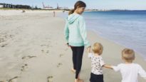 Children walk on beach