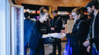 A Planetshakers volunteer serves a visitor to one of their food relief centres.